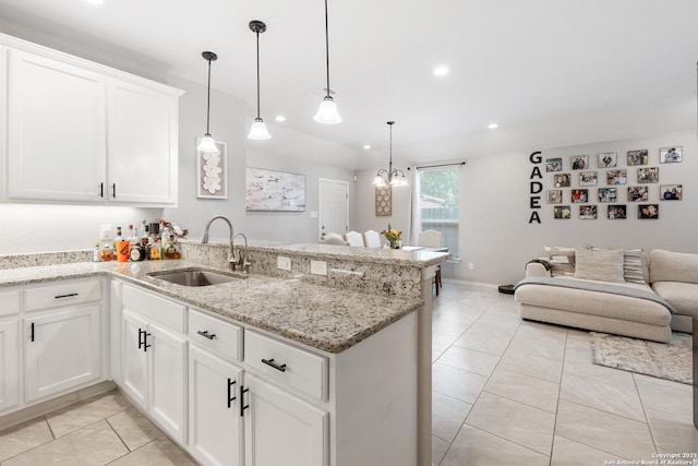 422 42nd, San Antonio, TX 78237 - kitchen featuring a sink, a peninsula, light tile patterned floors, open floor plan, and recessed lighting