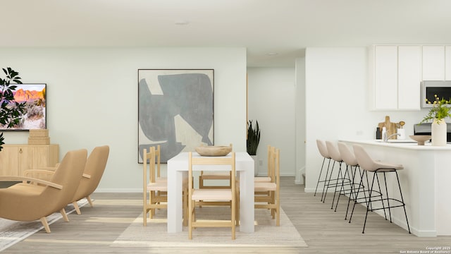 5658 Azure Aly, San Antonio, TX 78223 - dining room featuring light wood-style floors and baseboards