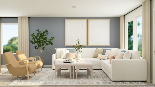 5658 Azure Aly, San Antonio, TX 78223 - living area with healthy amount of natural light, light wood-style floors, and baseboards