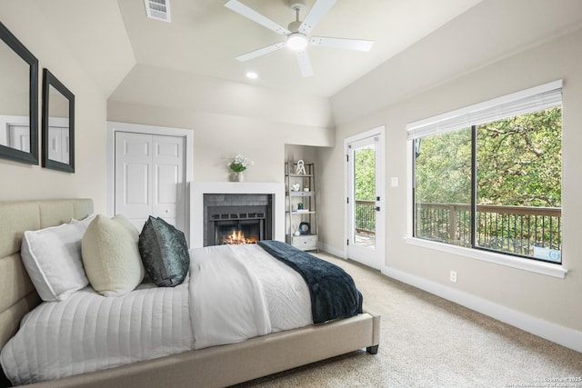 29302 Grand Coteau, Boerne, TX 78015 - carpeted bedroom featuring vaulted ceiling, baseboards, access to outside, a warm lit fireplace, and ceiling fan