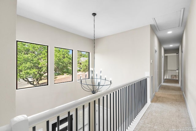 29302 Grand Coteau, Boerne, TX 78015 - hallway with light carpet, attic access, a chandelier, recessed lighting, and baseboards