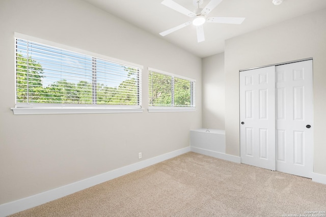 29302 Grand Coteau, Boerne, TX 78015 - unfurnished bedroom with carpet flooring, baseboards, a closet, vaulted ceiling, and a ceiling fan