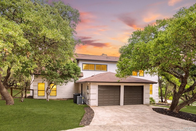 29302 Grand Coteau, Boerne, TX 78015 - view of front facade with driveway, a yard, an attached garage, and central AC unit