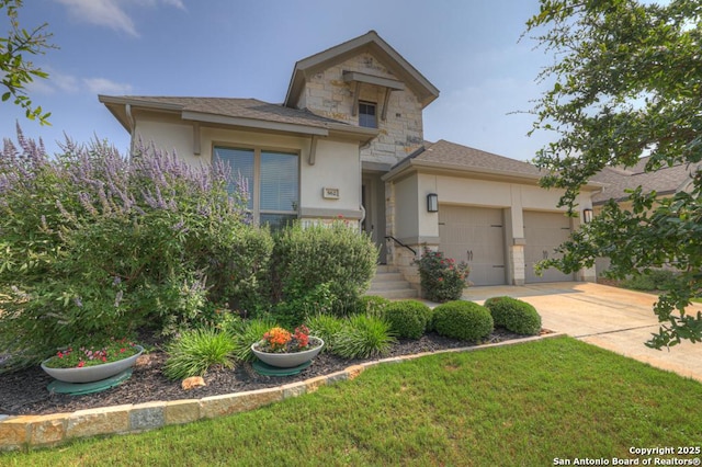562 Orchard Way, New Braunfels, TX 78132 - view of front of house featuring stone siding, stucco siding, an attached garage, driveway, and a front yard