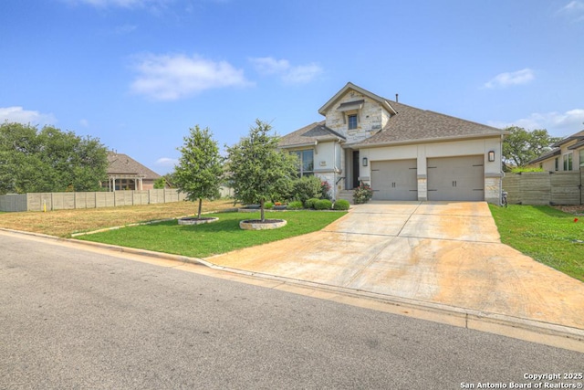 562 Orchard Way, New Braunfels, TX 78132 - view of front of property featuring stone siding, concrete driveway, a garage, and stucco siding