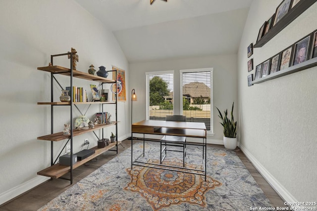 562 Orchard Way, New Braunfels, TX 78132 - office area featuring wood finished floors, vaulted ceiling, baseboards, and a textured wall