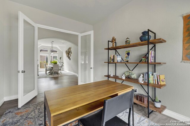 562 Orchard Way, New Braunfels, TX 78132 - office area featuring french doors, arched walkways, wood finished floors, and baseboards