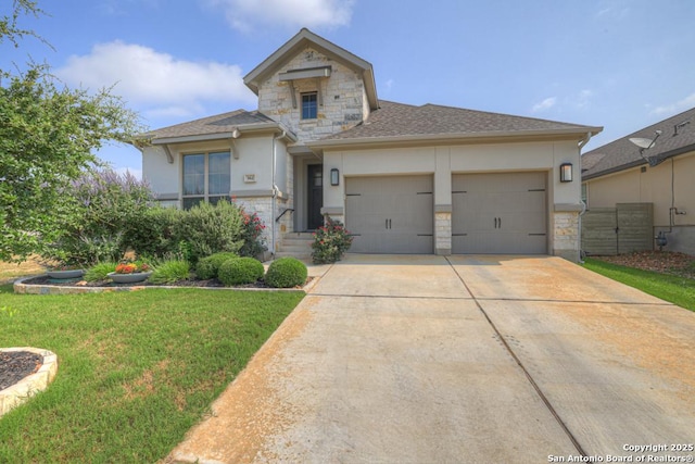 562 Orchard Way, New Braunfels, TX 78132 - view of front of home with stone siding, a garage, stucco siding, driveway, and a front lawn