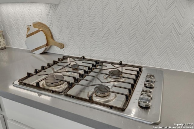 562 Orchard Way, New Braunfels, TX 78132 - kitchen view of wallpapered walls and stainless steel gas stovetop