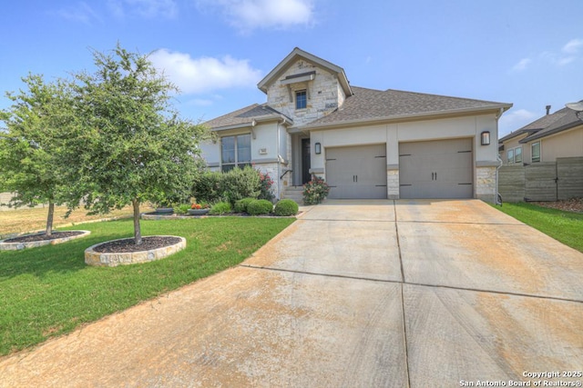 562 Orchard Way, New Braunfels, TX 78132 - view of front of home with stone siding, driveway, a garage, and stucco siding