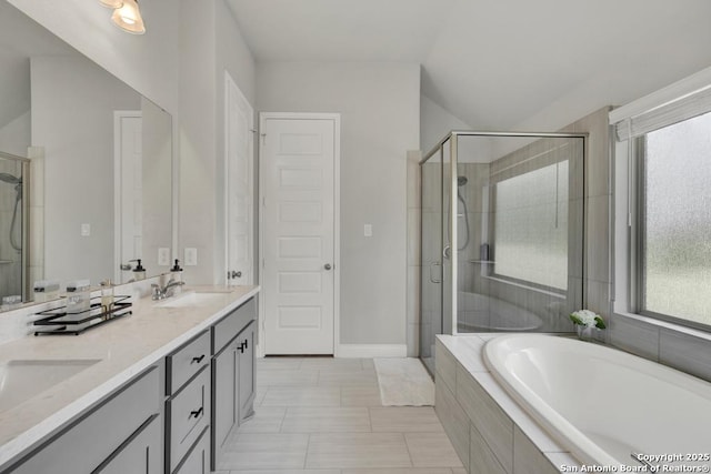 562 Orchard Way, New Braunfels, TX 78132 - bathroom with a garden tub, a stall shower, double vanity, and plenty of natural light