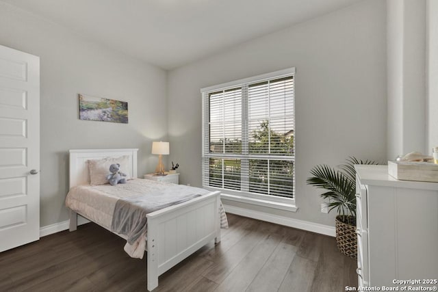 562 Orchard Way, New Braunfels, TX 78132 - bedroom featuring baseboards and dark wood-type flooring