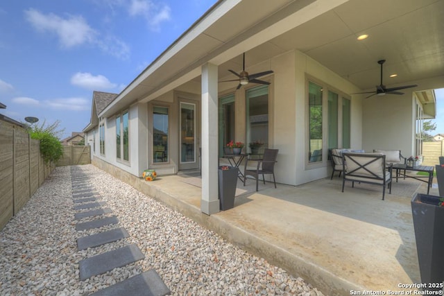 562 Orchard Way, New Braunfels, TX 78132 - fenced backyard featuring a ceiling fan, a patio area, and an outdoor hangout area