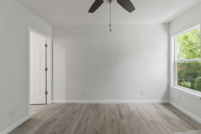 1711 Hermine, San Antonio, TX 78201 - spare room with wood finished floors, a ceiling fan, and baseboards