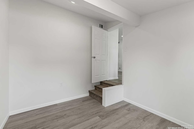 1711 Hermine, San Antonio, TX 78201 - spare room featuring wood finished floors, baseboards, and stairs