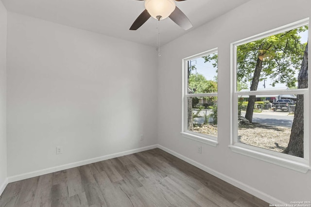 1711 Hermine, San Antonio, TX 78201 - spare room featuring wood finished floors, baseboards, and a ceiling fan