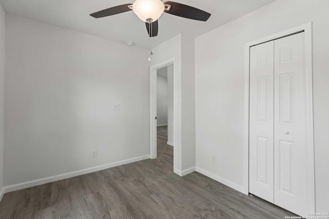 1711 Hermine, San Antonio, TX 78201 - unfurnished bedroom featuring wood finished floors, baseboards, a closet, and a ceiling fan