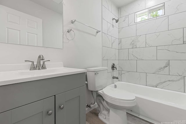 1711 Hermine, San Antonio, TX 78201 - bathroom with vanity, toilet, washtub / shower combination, and wood finished floors