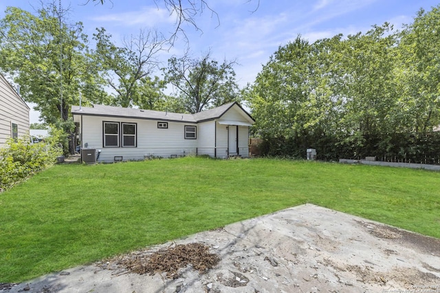 1711 Hermine, San Antonio, TX 78201 - rear view of property featuring a yard, a patio area, and central air condition unit