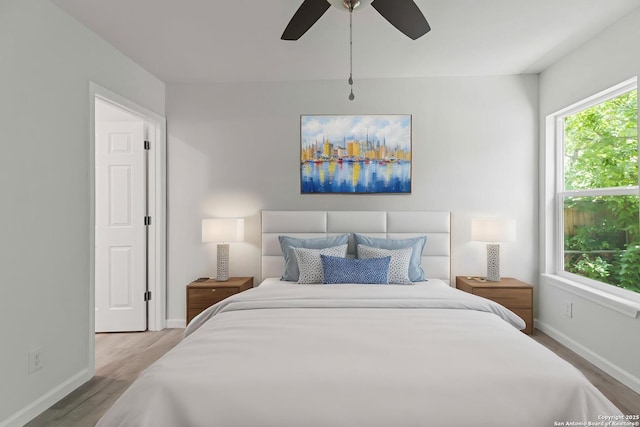 1711 Hermine, San Antonio, TX 78201 - bedroom with wood finished floors, baseboards, and ceiling fan