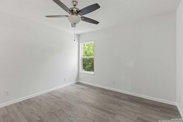 1711 Hermine, San Antonio, TX 78201 - spare room with a ceiling fan, baseboards, and wood finished floors