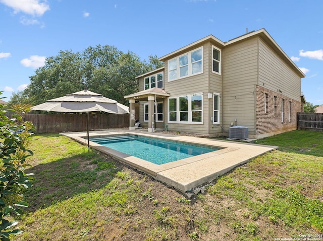 20310 Roche Oak, San Antonio, TX 78259 - back of property with brick siding, central air condition unit, and a patio