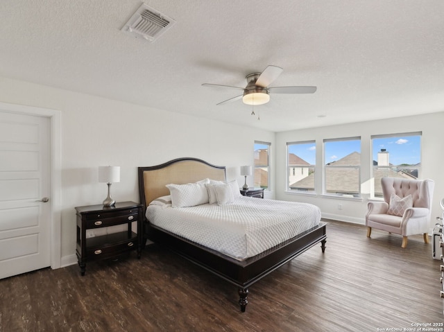 20310 Roche Oak, San Antonio, TX 78259 - bedroom featuring wood finished floors, baseboards, a textured ceiling, and a ceiling fan