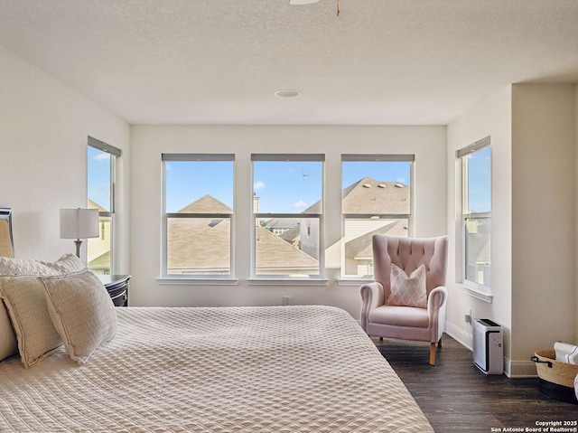 20310 Roche Oak, San Antonio, TX 78259 - bedroom with wood finished floors, multiple windows, and baseboards