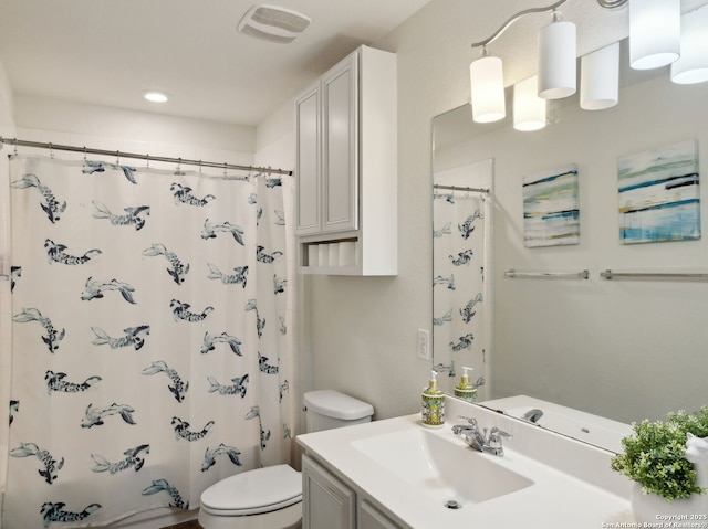 20310 Roche Oak, San Antonio, TX 78259 - bathroom with toilet, vanity, and curtained shower