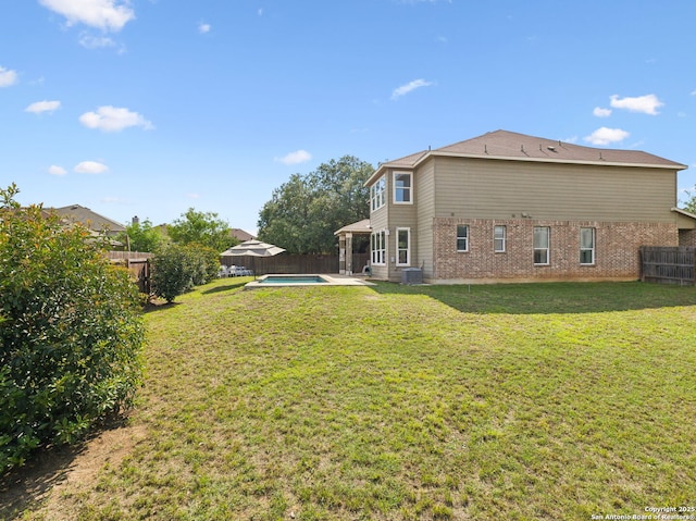 20310 Roche Oak, San Antonio, TX 78259 - rear view of house with brick siding, a patio area, and central air condition unit