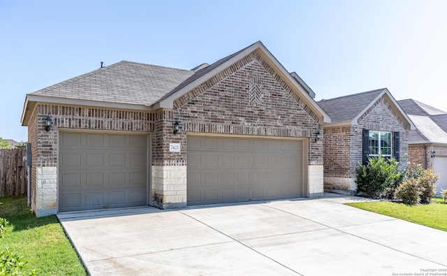 7421 Cimarron Lk, Boerne, TX 78015 - view of front of home featuring brick siding, a garage, and driveway