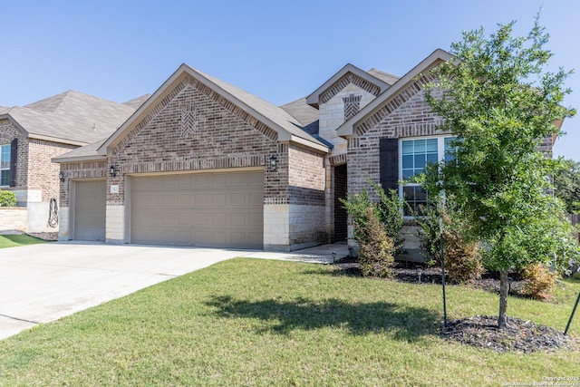 7421 Cimarron Lk, Boerne, TX 78015 - view of front facade with brick siding, a garage, concrete driveway, a front yard, and stone siding