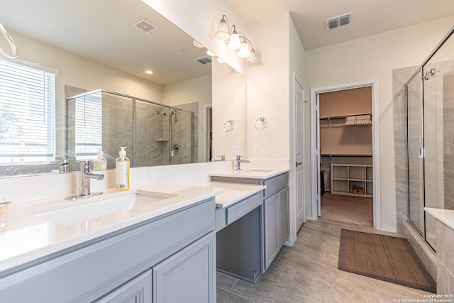 7421 Cimarron Lk, Boerne, TX 78015 - bathroom with double vanity, a shower stall, and a walk in closet