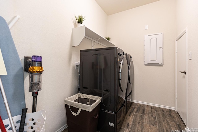 7421 Cimarron Lk, Boerne, TX 78015 - laundry area featuring washing machine and clothes dryer, dark wood-style flooring, electric panel, and baseboards