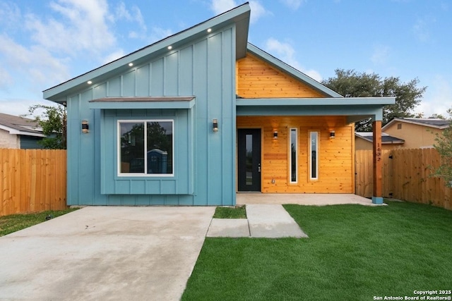 1422 Sherman, San Antonio, TX 78202 - view of front of house featuring board and batten siding and a patio