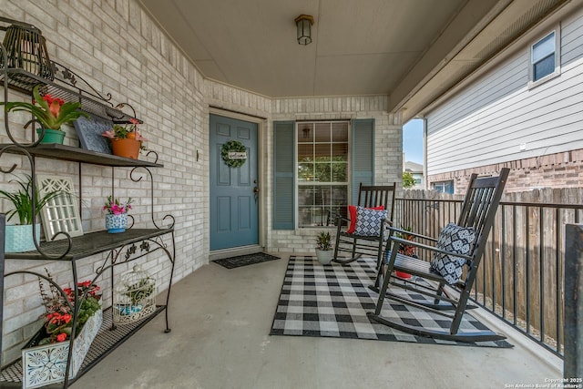 12707 Avens Arbor, San Antonio, TX 78253 - view of exterior entry featuring covered porch, stone siding, and brick siding