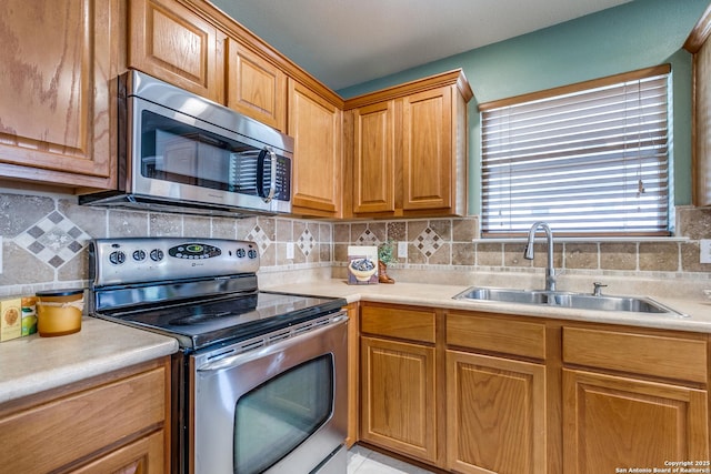 12707 Avens Arbor, San Antonio, TX 78253 - kitchen with appliances with stainless steel finishes, a sink, light countertops, and decorative backsplash