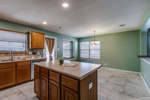 12707 Avens Arbor, San Antonio, TX 78253 - kitchen featuring dishwasher, a sink, plenty of natural light, brown cabinetry, and recessed lighting