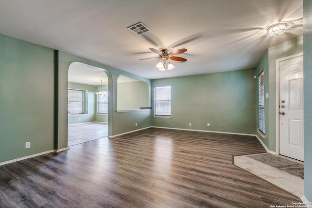 12707 Avens Arbor, San Antonio, TX 78253 - unfurnished room featuring arched walkways, ceiling fan, wood finished floors, and baseboards