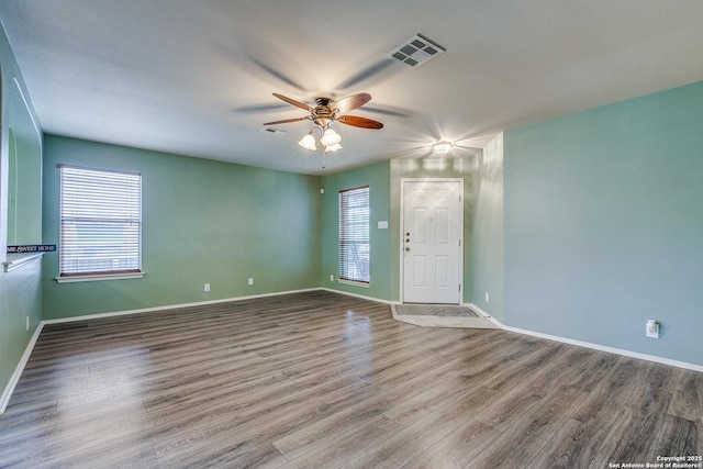 12707 Avens Arbor, San Antonio, TX 78253 - unfurnished room featuring plenty of natural light, a ceiling fan, wood finished floors, and baseboards