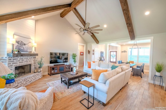 113 Bayberry Ct, La Vernia, TX 78121 - living area featuring beamed ceiling, light wood-style floors, baseboards, ceiling fan, and high vaulted ceiling