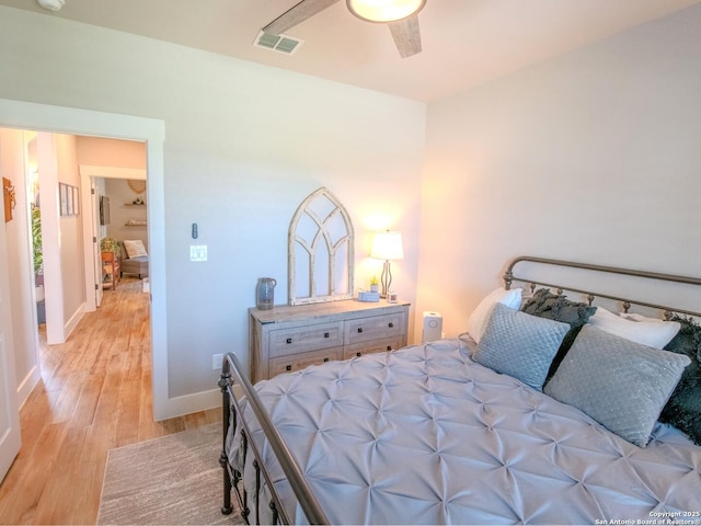 113 Bayberry Ct, La Vernia, TX 78121 - bedroom featuring light wood-style flooring, baseboards, and a ceiling fan