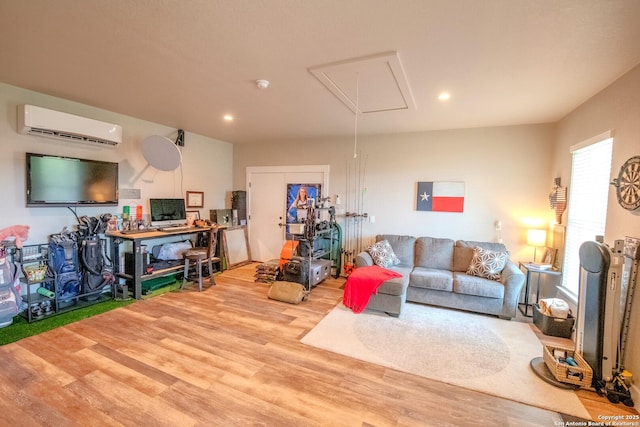 113 Bayberry Ct, La Vernia, TX 78121 - living area featuring attic access, a wall mounted AC, wood finished floors, and recessed lighting