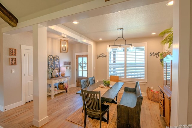 113 Bayberry Ct, La Vernia, TX 78121 - dining space with light wood-style floors, plenty of natural light, baseboards, recessed lighting, and beamed ceiling