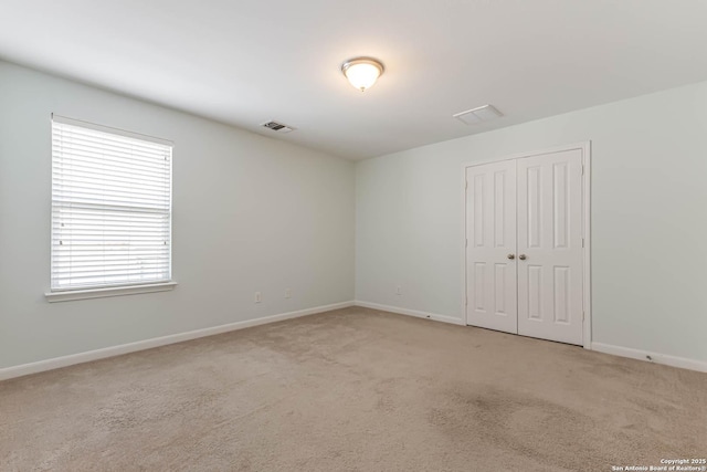 3319 Brooktree Ct, San Antonio, TX 78261 - unfurnished bedroom with light colored carpet, a closet, and baseboards