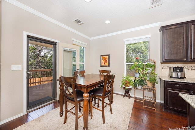 10772 Texas Star, Helotes, TX 78023 - dining room featuring ornamental molding, dark wood-style flooring, baseboards, and recessed lighting