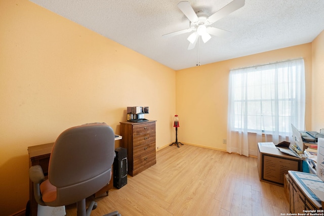 11334 Bald Mountain Dr, San Antonio, TX 78245 - office featuring a ceiling fan, light wood-style floors, and a textured ceiling
