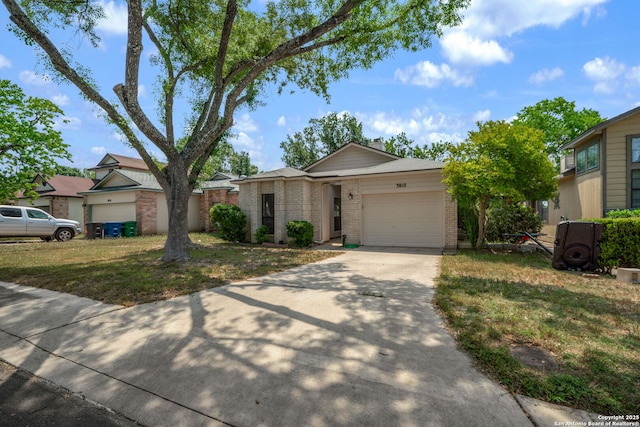 5810 Spring Grn, San Antonio, TX 78247 - view of front of house with brick siding, a garage, driveway, and a front yard