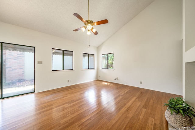 5810 Spring Grn, San Antonio, TX 78247 - spare room featuring ceiling fan, light wood-style floors, high vaulted ceiling, and baseboards