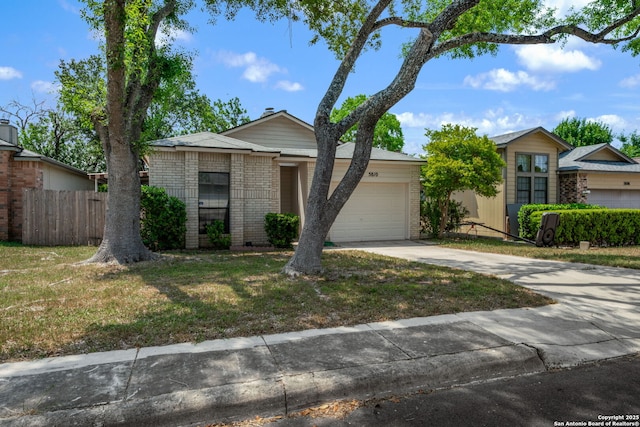 5810 Spring Grn, San Antonio, TX 78247 - view of front of property with brick siding, a garage, and driveway